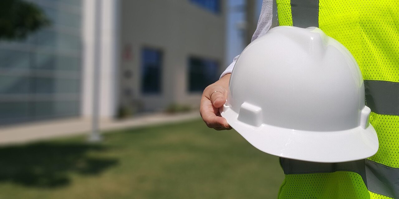 hardhat-4274430_1280 A licensed contractor holding a white hard hat in front of a new remodel
