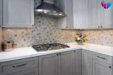 new stovetop and counters with a custom backsplash