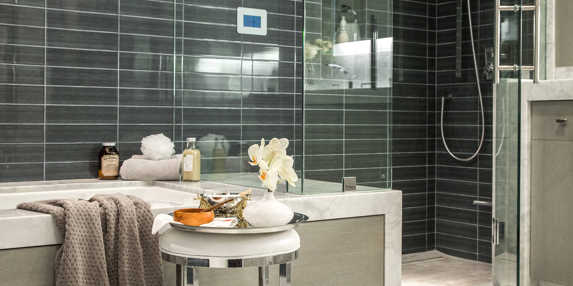 A bathroom following the at-home-spa remodeling trend, complete with a steam shower panel